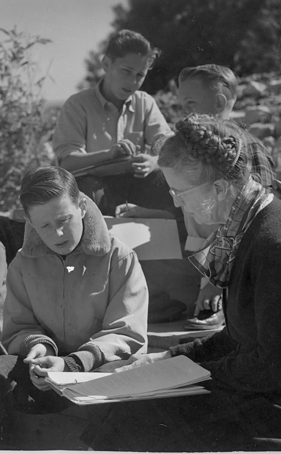 Founder Margaret Chadwick works with students outside at Chadwick School.