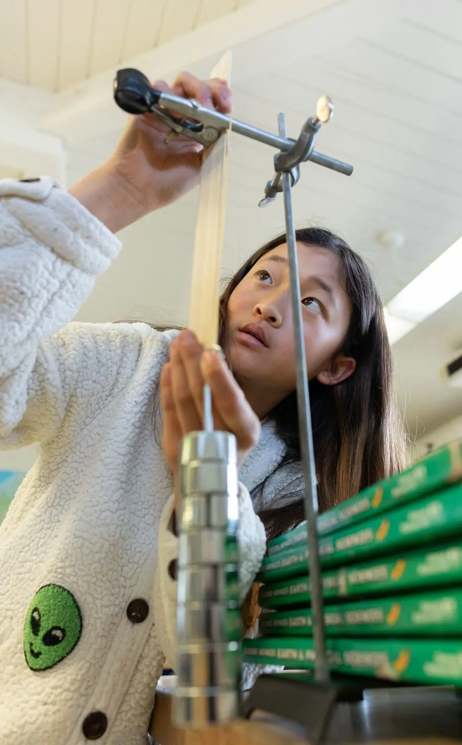 Chadwick student conducts an experiment during science lab.