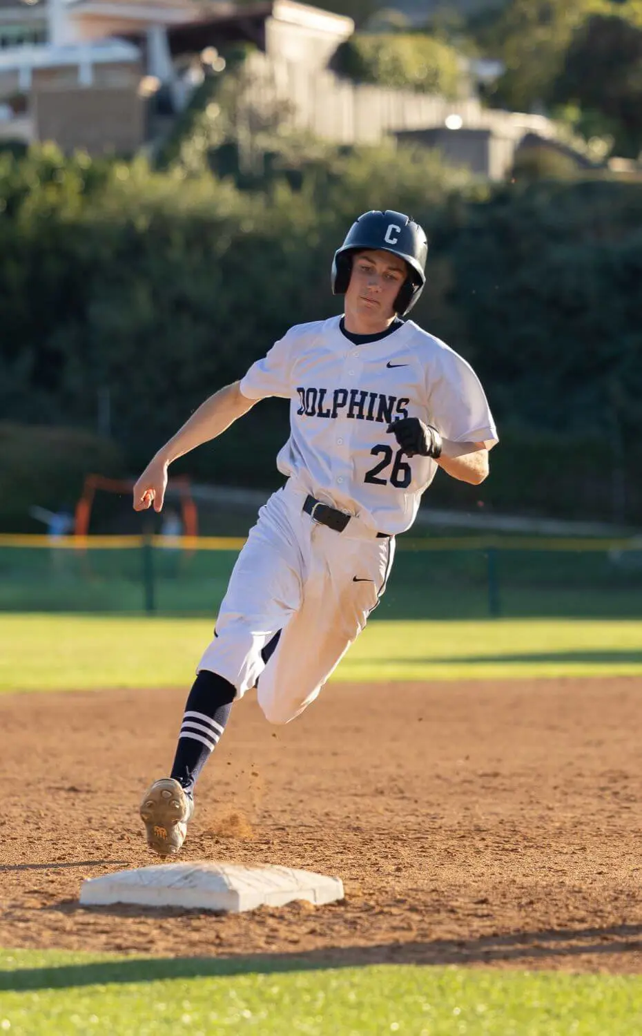 Chadwick Baseball team member running to base.