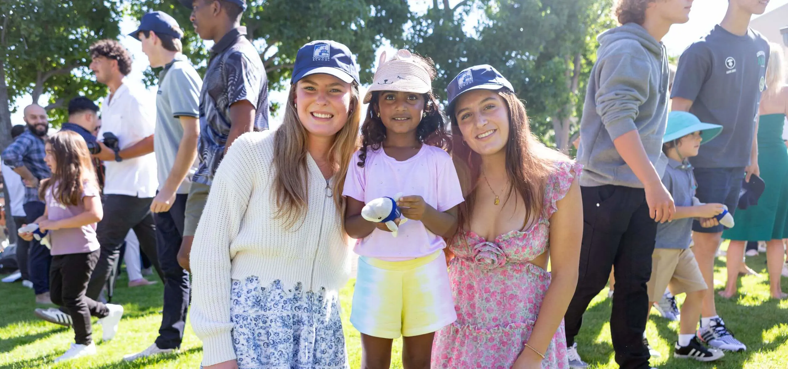 Upper and Lower School students posing for a photograph together at a Chadwick event.
