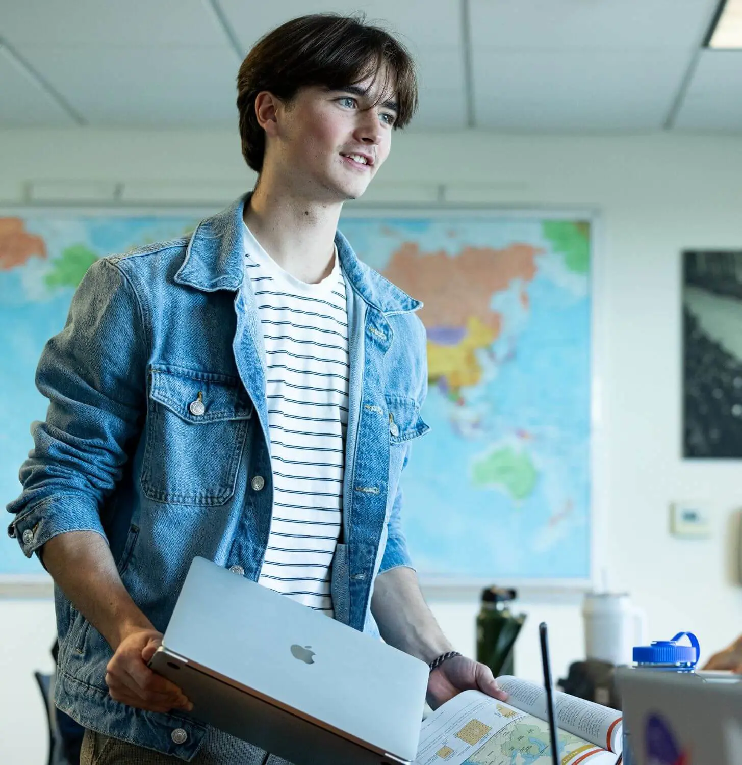Upper School student engages in conversation in history class.