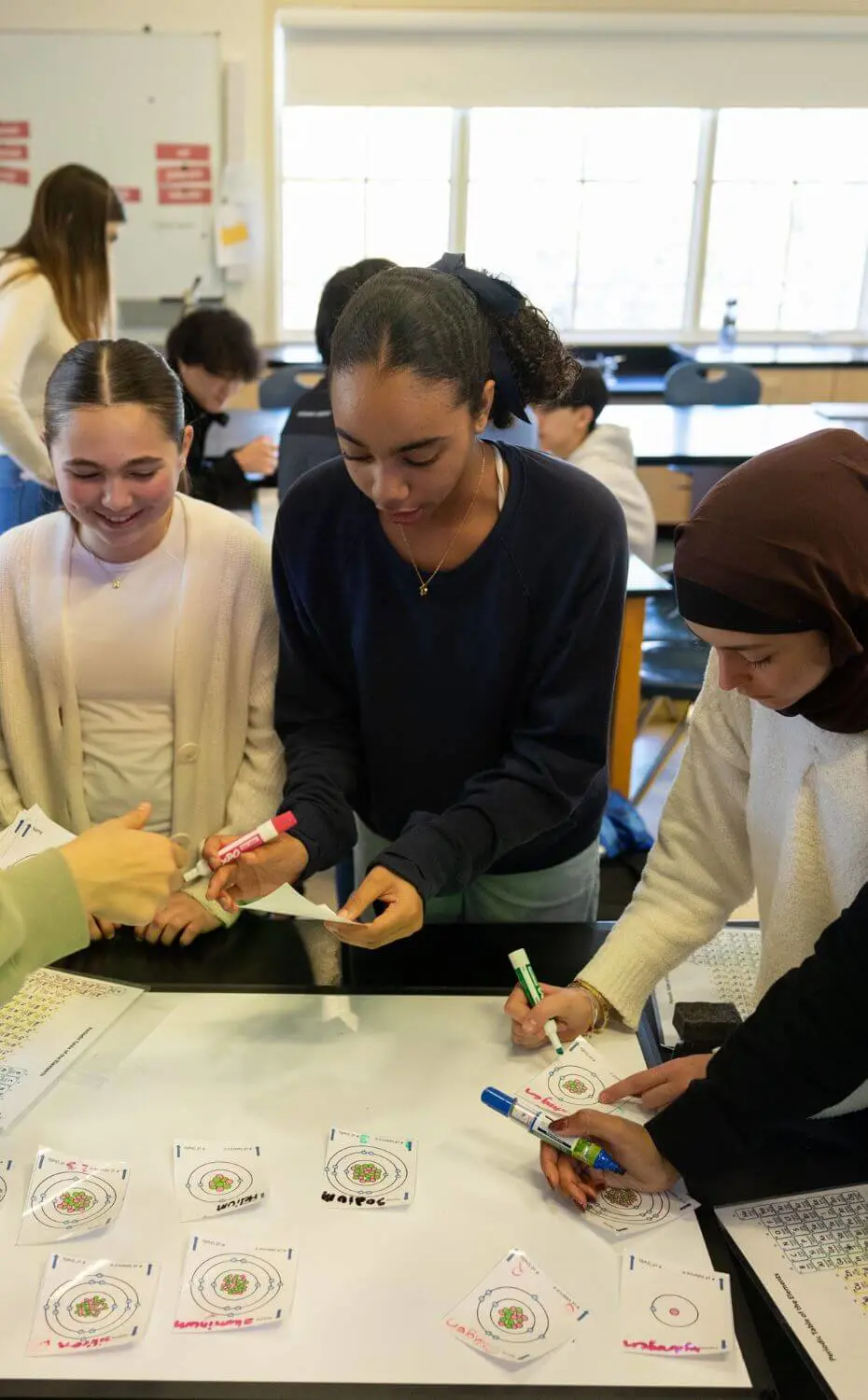 Through this activity, they discovered that the periodic table is intentionally organized: the columns indicate the number of valence electrons, while the rows represent the number of electron shells.