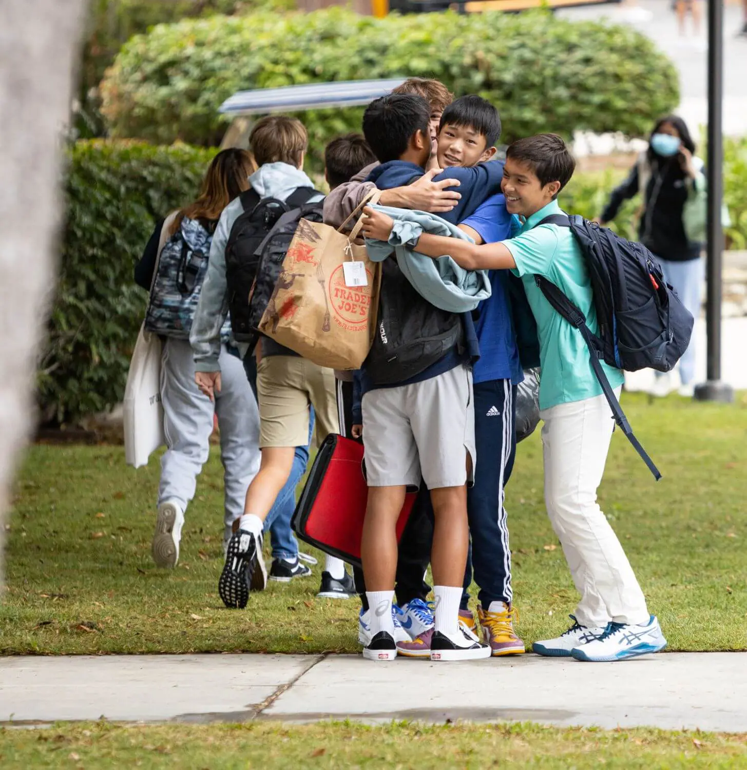 Students having a group hug.