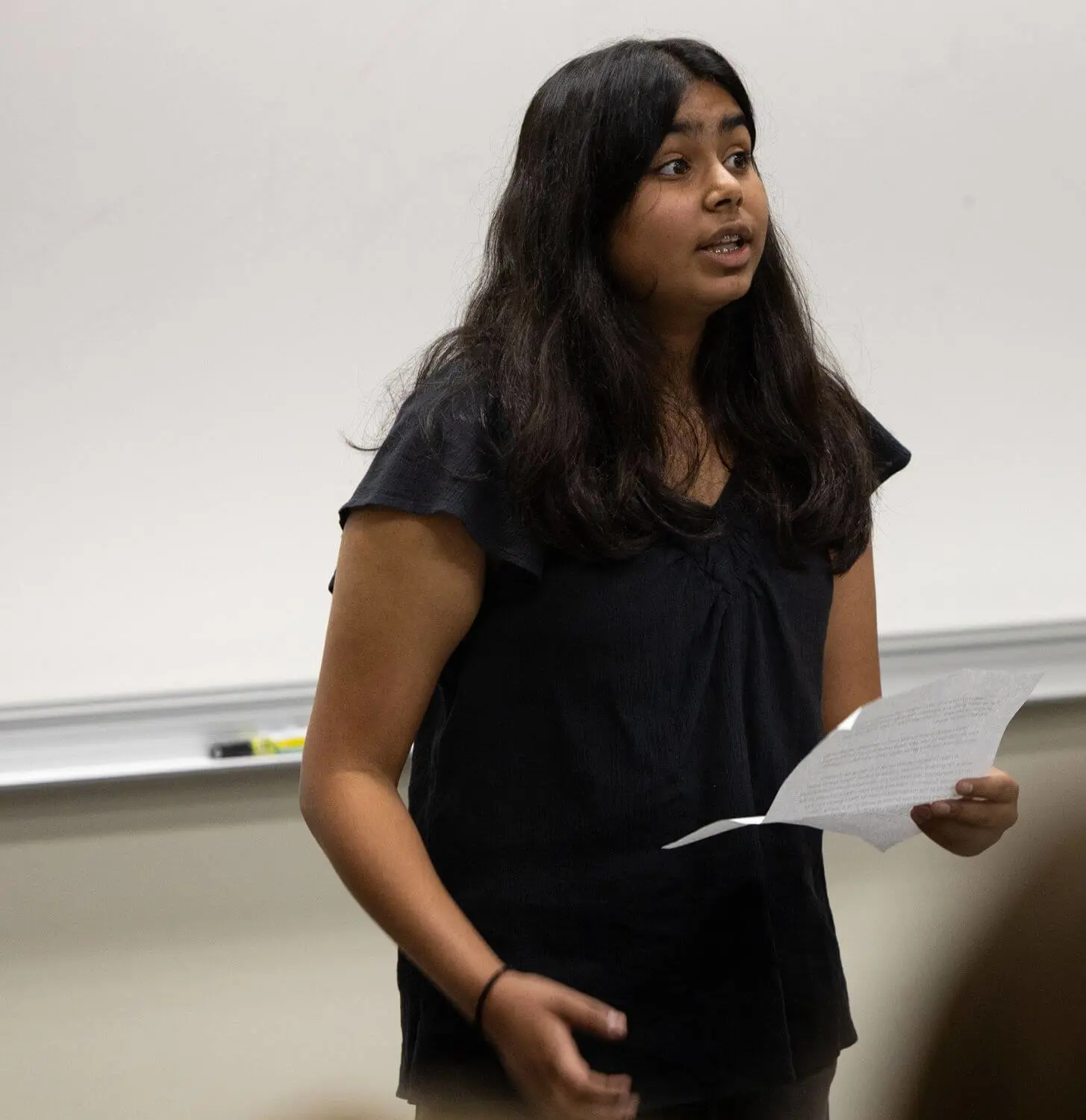 Middle School student gives a speech in front of their peers.