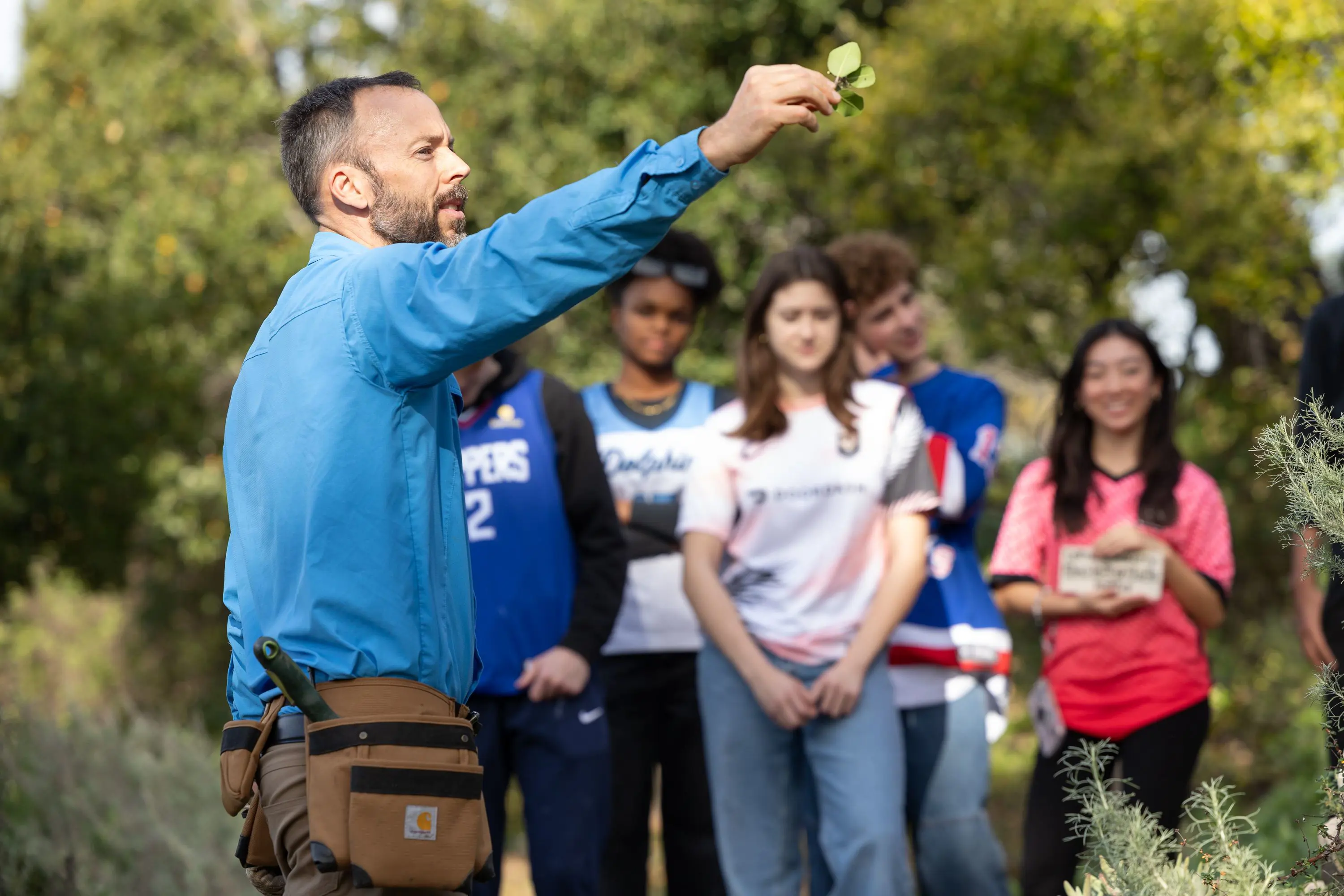 Eco Club students and teacher Pete Nordlund meet in Chadwick Canyon before working on the trail behind the school..