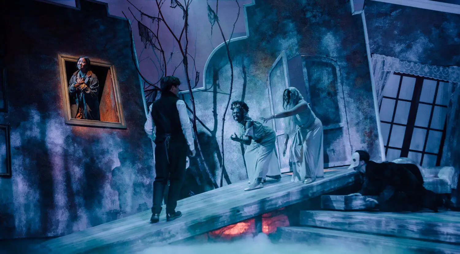 Upper School students performing in a theater production of Dracula.