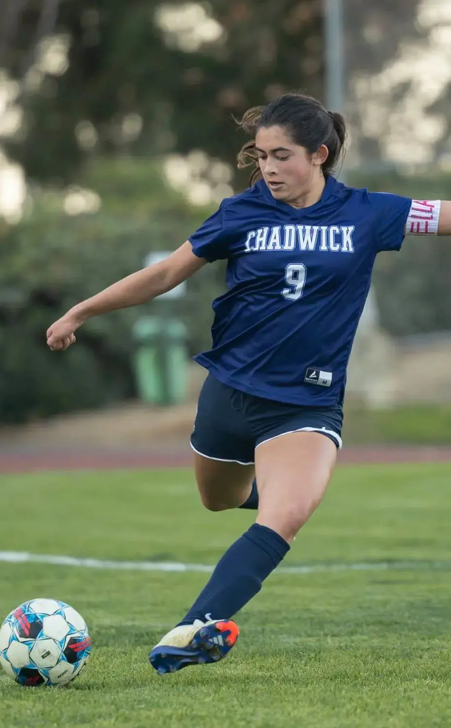 Chadwick Girls Soccer player runs with ball toward the goal.