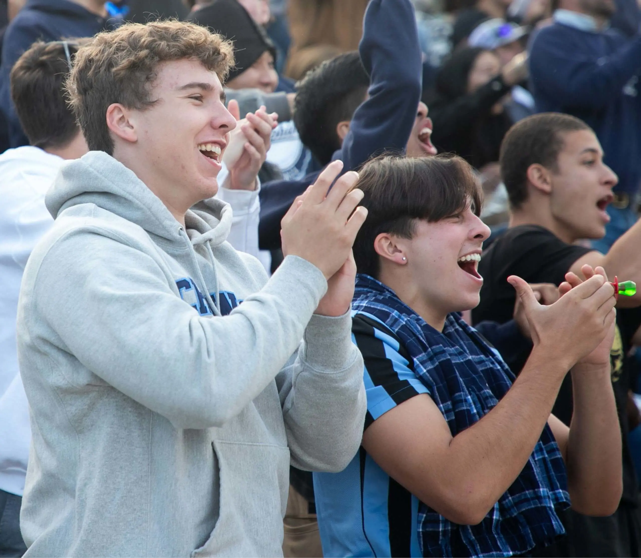 Students cheer from the stands.