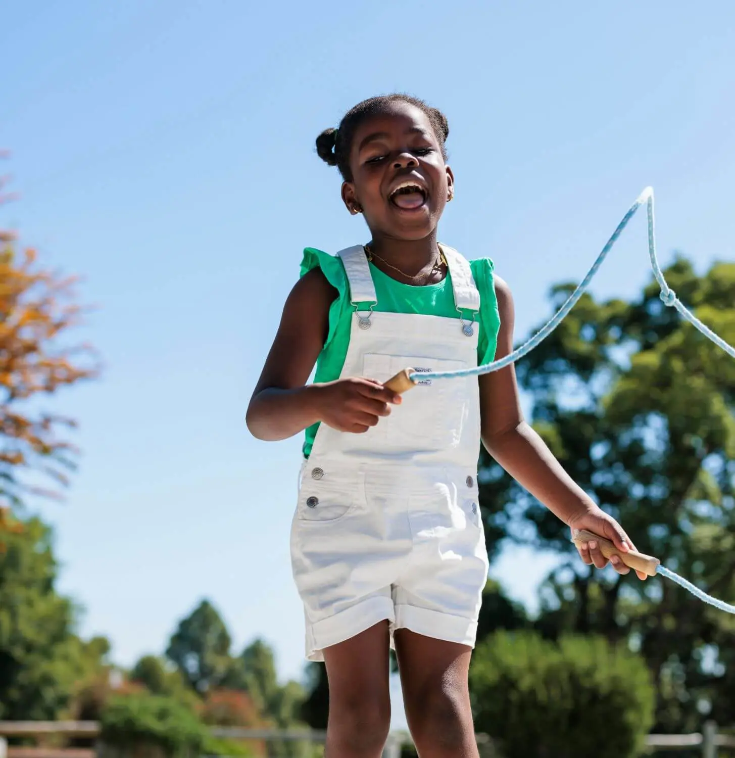 A student plays with a skipping rope at recess.
