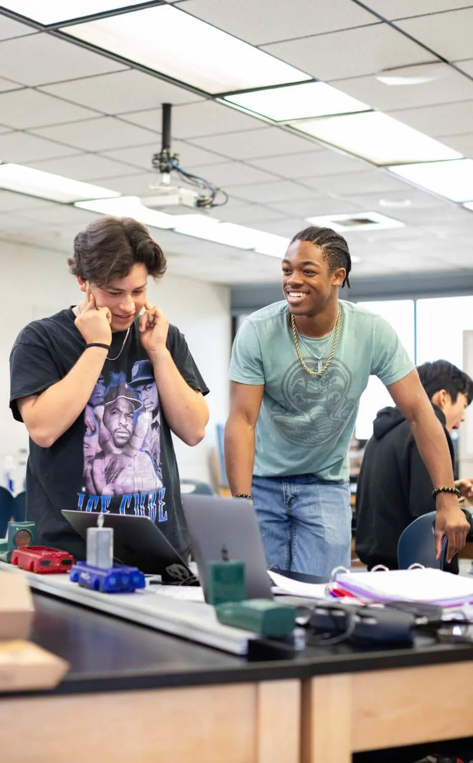 Two Chadwick students share a smile in class.